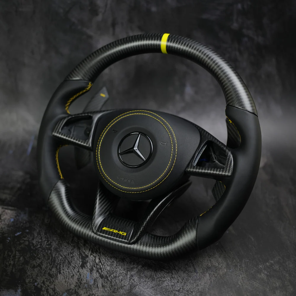 Mercedes carbon fiber steering wheel with premium performance-oriented interior design