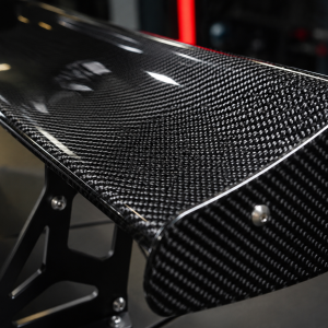 Carbon fiber wings for luxury performance cars